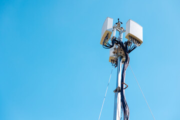 Fototapeta na wymiar omni setup outdoor wifi, wireless internet network access point tower, 5G antenna against clear blue sky