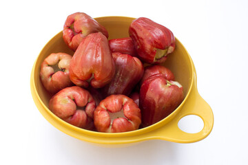 Rose apple fruit (syzygium jambos) isolated on white background. Rose apples have a variety of health benefits, like improving heart health, promoting immunity, controlling diabetes, and improving dig