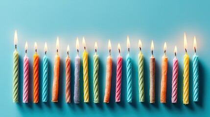 Colorful birthday candles burning in a row, celebrating joy and light