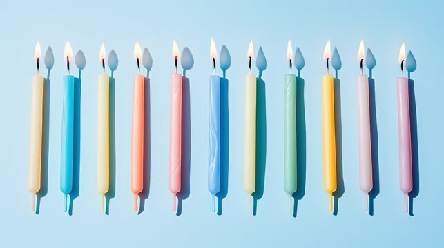 Colorful birthday candles burning in a row, celebrating joy and light