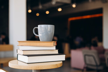 Cozy coffee shop ambiance with books and mug