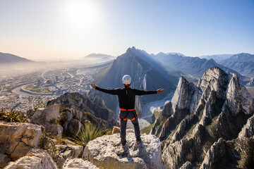 Man enjoys view while rappelling in Eagle's Nest