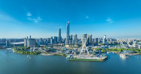 Obraz premium Panorama of modern commercia buildings and wide lake view in Suzhou, China on a clear day.