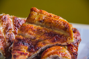 Close-up view of deliciously grilled chicken, showcasing its enticing texture and appetizing appearance, perfect for culinary enthusiasts and food photography lovers alike.