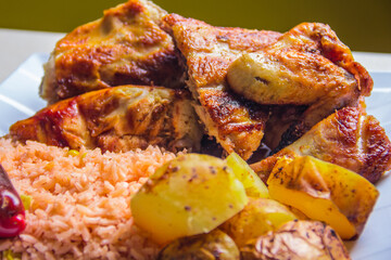 An artistic food composition featuring succulent grilled chicken, flavored rice, and golden roasted potatoes that reflect the joy and satisfaction of home-cooked meals.