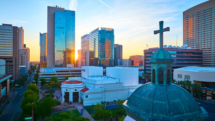 Aerial Downtown Phoenix Skyscrapers and Historic Church Dome at Sunset Fly Over