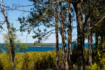 Looking through the red pines to Horseshoe Island in Green Bay, from Peninsula State Park, Fish Creek, Door County, Wisconsin in late May.