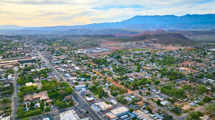 Aerial Small Town Residential Grid and Red Desert Mountains Hurricane Utah
