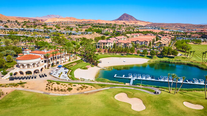 Aerial Luxury Golf Clubhouse Lake and Desert Villas Flyover