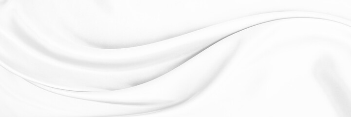 White gray satin texture that is white silver fabric silk panorama background with beautiful soft blur pattern natural.