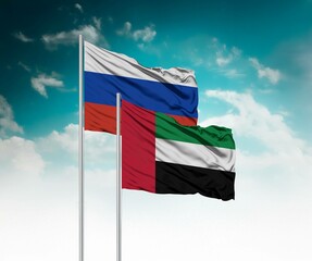 National flags of Russia and United Arab Emirates wave side by side in a clear blue sky...