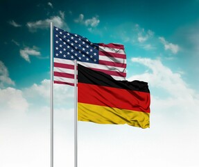  National flags of United States of America and Germany wave side by side in a clear blue sky symbolizing international unity and cooperation.