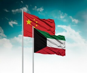  National flags of China and Kuwait wave side by side in a clear blue sky symbolizing international...