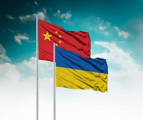  National flags of China and Ukraine wave side by side in a clear blue sky symbolizing...
