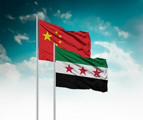  National flags of China and Syria wave side by side in a clear blue sky symbolizing international...
