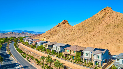 Aerial Fly Over Desert Suburban Homes and Mountain Ridge Lake Las Vegas