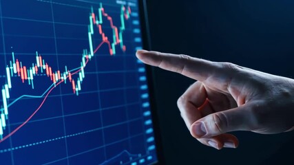 Hand on Stock chart up on screen, investing