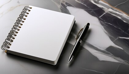 a blank hardcover notebook with a pen resting beside it lying on a marble surface perfect for logos or text mockups