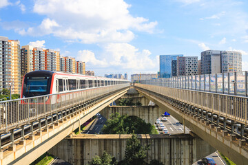 Urban rail transit under blue sky and white clouds in Kunming, Yunnan Province, China