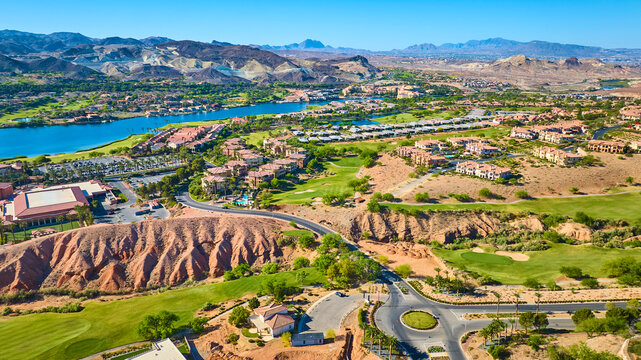 Aerial Luxury Desert Community Golf Course and Lake Oasis Fly Over