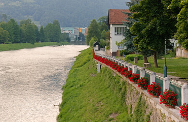 Riverside promenade in Lasko, Slovenia, during a summer evening