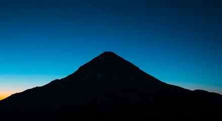 Majestic Mountain Silhouette at Twilight Dark Peak Serene Sky Dramatic Landscape