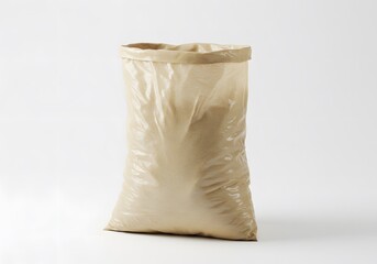 Beige plastic bag, full of granular material, against white background