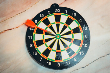 Goal concept. Close-Up of Dartboard with Arrow Targeting Bullseye, Perfect for Game and Leisure...
