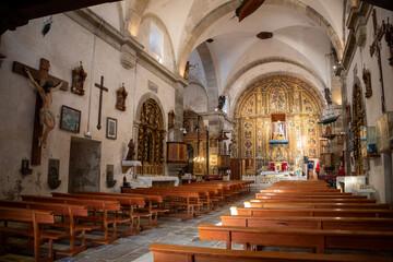 Fototapeta premium Sanctuary of A Virxe da Barca in Muxía, Galicia, Spain, perched on dramatic Atlantic cliffs. A key stop on the Camino de Santiago. Sunset.