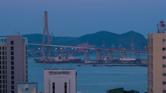 Busan, South Korea. Aerial view of skyscrapers in Busan, South Korea. Time-lapse during a cloudy spring evening