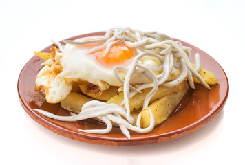 Fried eggs with imitation baby eels on a plate