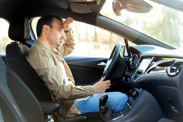Stressed tourist suffering headache during road trip vacation