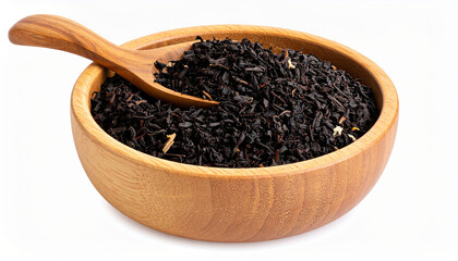 Dry black tea in wooden bowl and spoon. Natural product.