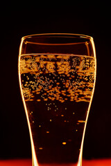 Close-up of sparkling water bubbles in a glass