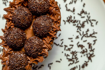 Brigadeiro chocolate easter egg in white plate background