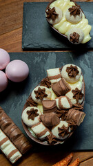 Chocolate easter egg on top of black stone