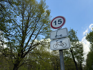 Traffic sign limiting speed for electric scooters and bicycles, symbolizing the integration of...
