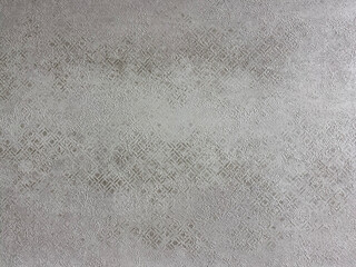 Textured gray surface with intricate patterns ideal for backgrounds and design projects