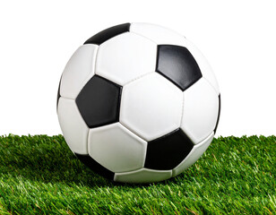 Classic black and white soccer ball resting on green turf, clean isolated PNG, Transparent PNG