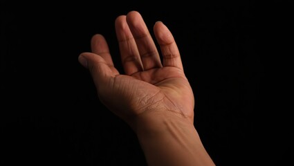 Fototapeta premium A trembling hand reaches out in hope, fingers slightly curled, skin folds detailed to express vulnerability and longing.