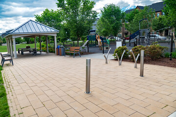Walking area in a residential neighborhood in suburbia. Rows of apartment buildings with lawns and a play area.