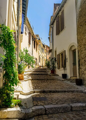 Cobblestone walkway between European buildings
