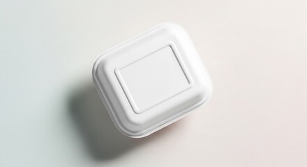 Minimalist Top View of a Closed White Square Food Container with Soft Shadow.