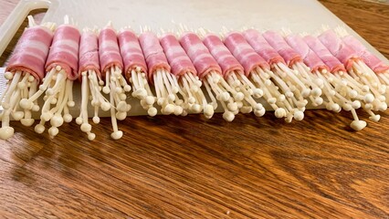 Crispy bacon-wrapped enoki mushrooms, umami fusion delight, Lunar New Year appetizer, whimsical...