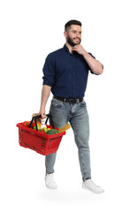 Man with shopping basket full of products on white background