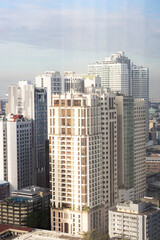 Fototapeta premium Looking out hotel window at skyscrapers Manila Philippines 2025 