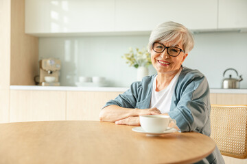 Portrait of confident stylish european middle aged senior woman. Older mature 60s lady smiling at home. Happy attractive senior female looking camera close up face headshot portrait. Happy people