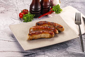 Delicous natural roasted sausages in the plate