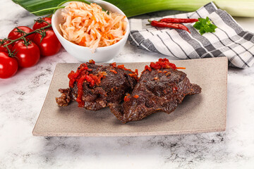Baked beef cheeks with vegetables
