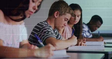 Image of statistical data processing over diverse group of students studying in class at school